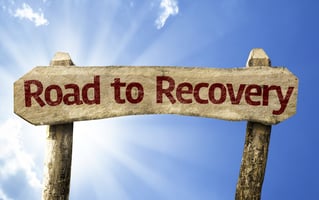 Sign that reads road to recovery.